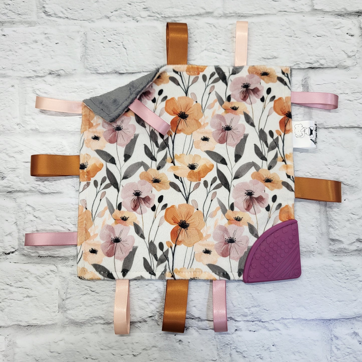 Fleurs orangé et mauve - Doudou étiquettes craquante avec coin de dentition