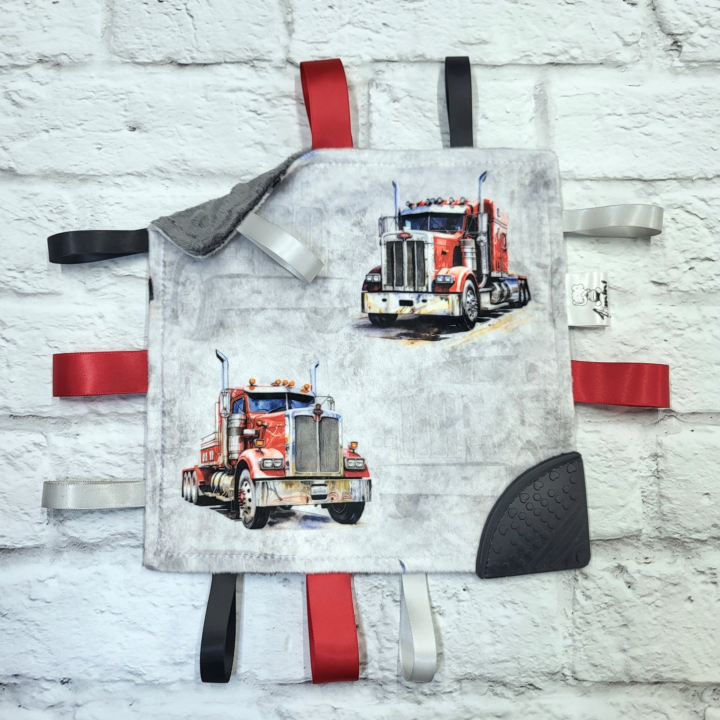 Le camionneur - Doudou étiquettes craquante avec coin de dentition