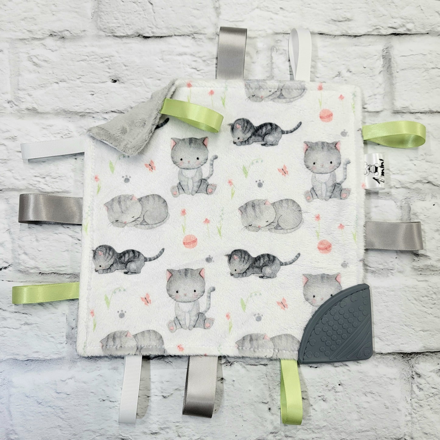 Grisou - Doudou étiquettes craquante avec coin de dentition